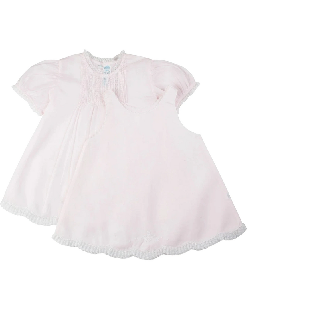 That Store vintage style pink slip dress with delicate lace trim, pintucks, and floral embroidery for little girls.