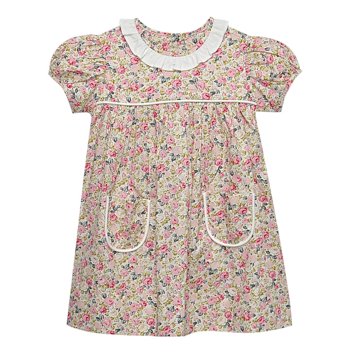 That Store Floral Pink Rose Reagan Dress with white ruffled collar, puff sleeves, and front pockets on floral fabric.