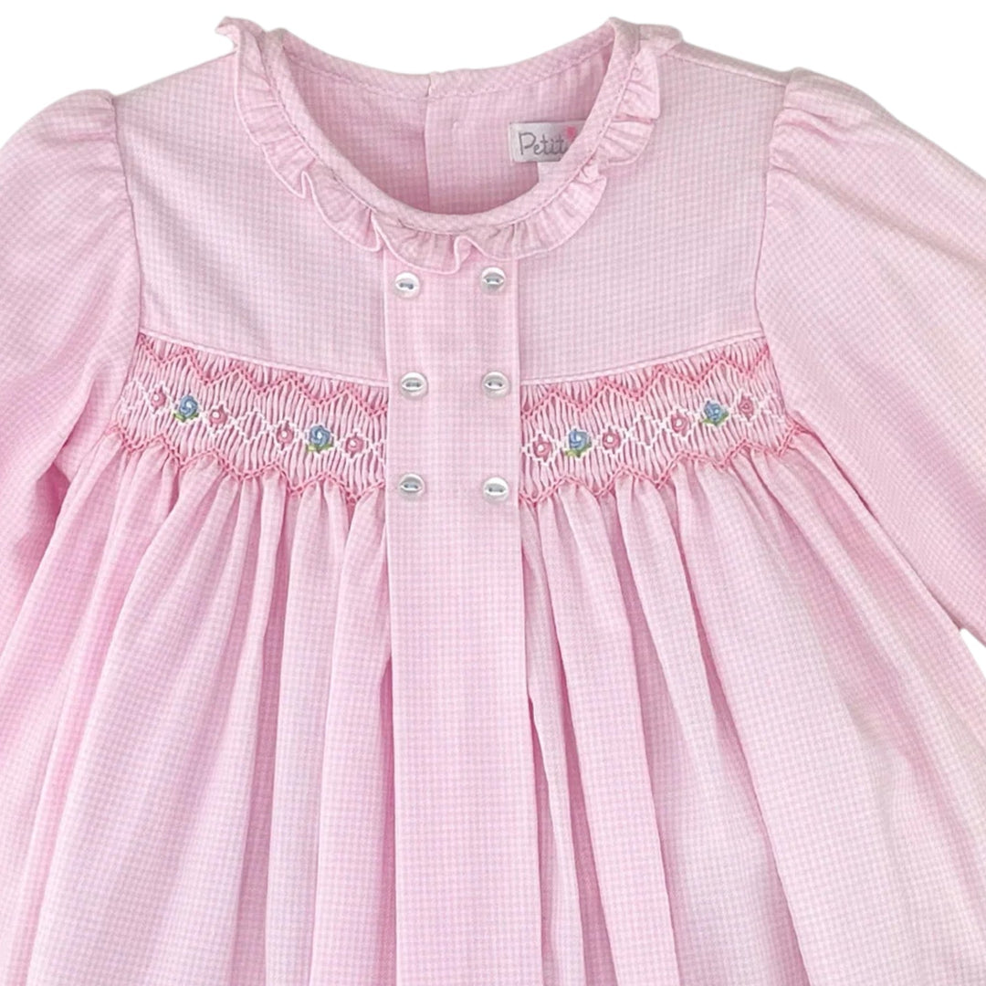 That Store pink micro check long sleeve dress with smocked bodice, floral embroidery, and ruffled collar detail.
