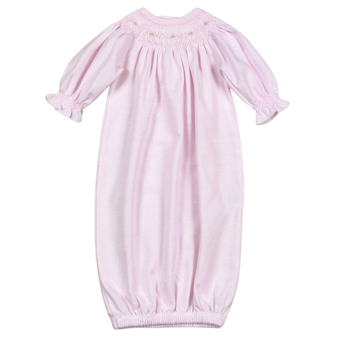 That Store baby girl gown in soft pink stripes with hand smocking and floral details, made from breathable Pima cotton.