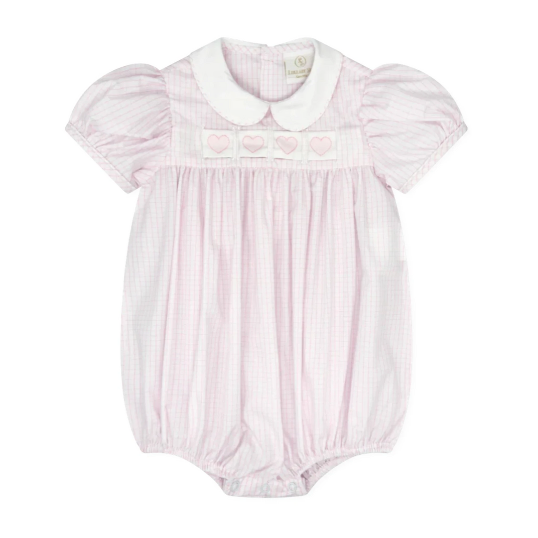 That Store Ruth Ribbon Bubble in classic pink windowpane fabric with a white Peter Pan collar and heart embroidery.
