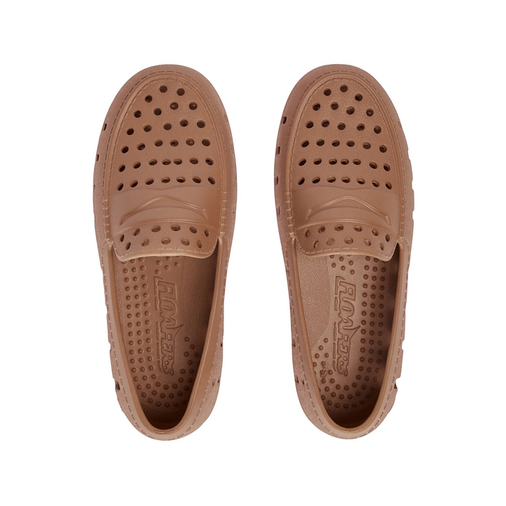 That Store Prodigy tan waterproof foam loafers for kids with breathable ventilation holes and rubber soles.