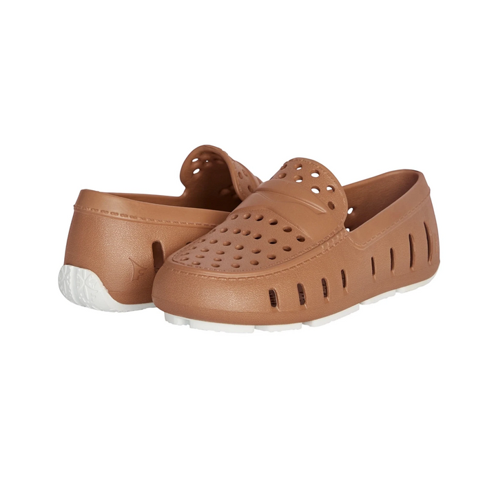 That Store Prodigy loafers in tan with bright white soles, featuring breathable foam construction for kids.