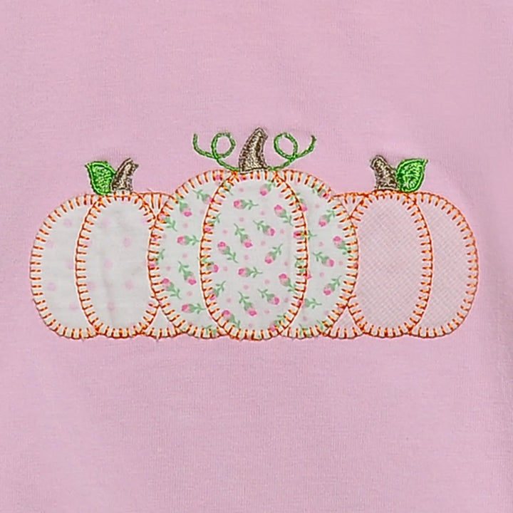 That Store pink cotton bubble featuring a festive pumpkin applique with floral and polka dot fabric patterns