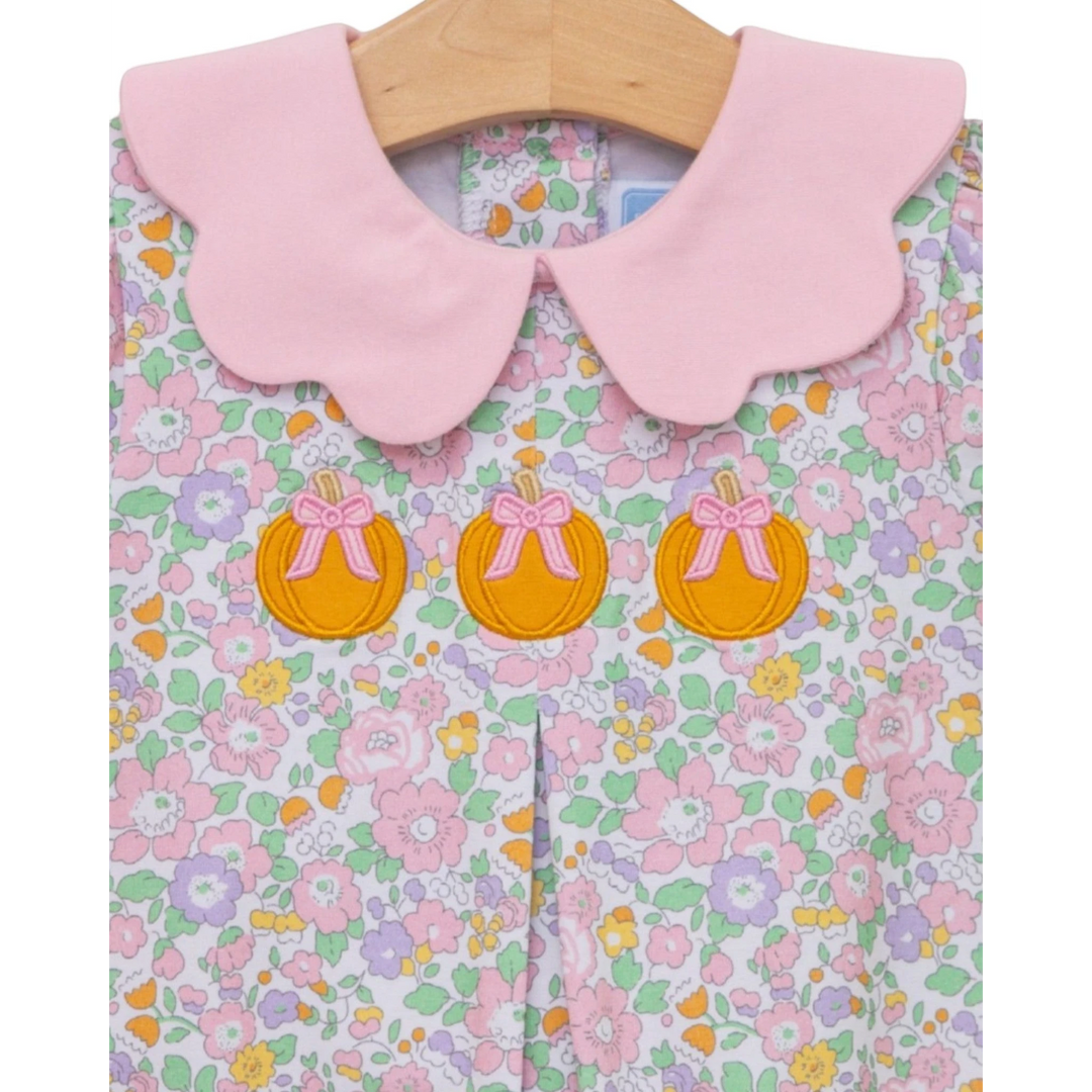 That Store girls bubble featuring a pink scalloped collar and pumpkin appliqué on a pastel floral cotton print