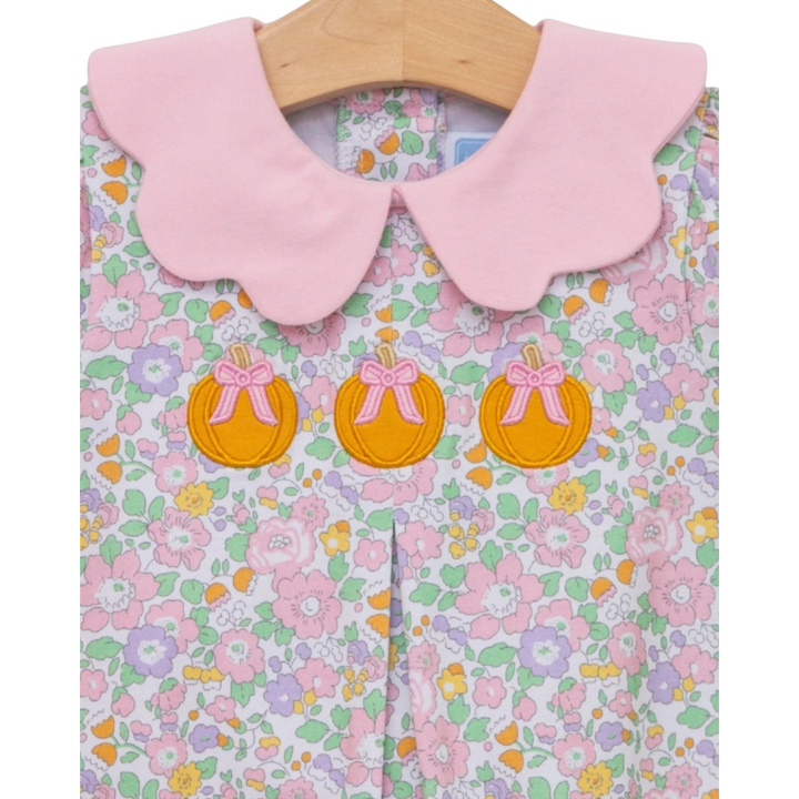 That Store girls bubble featuring a pink scalloped collar and pumpkin appliqué on a pastel floral cotton print