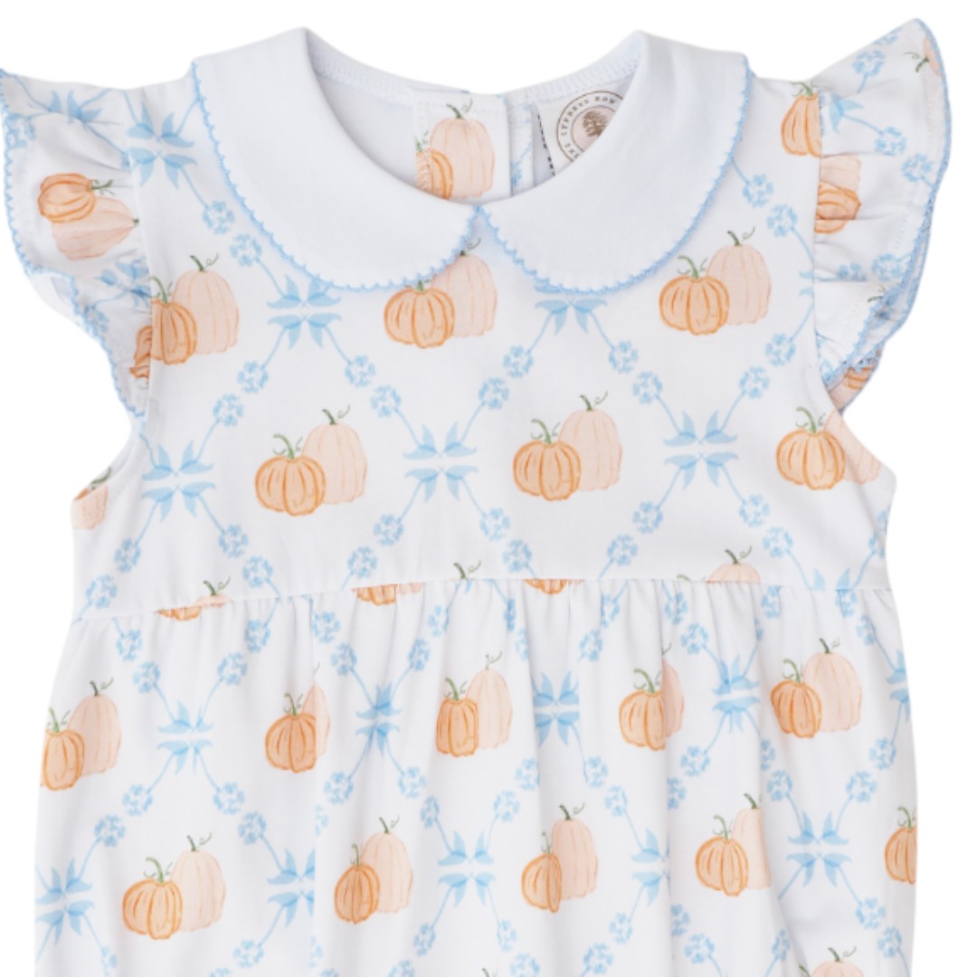 That Store girls bubble featuring a white fabric with orange pumpkin print, blue ruffled sleeves, and peter pan collar