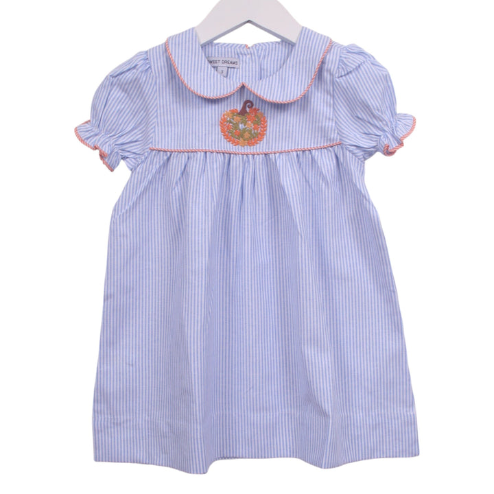 That Store blue and white pinstripe dress with pumpkin embroidery, Peter Pan collar, and orange piping detail.