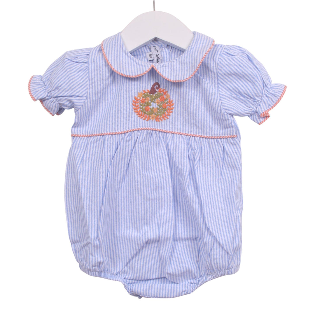 That Store girls blue and white striped bubble romper featuring a pumpkin embroidery and pink piping trim.