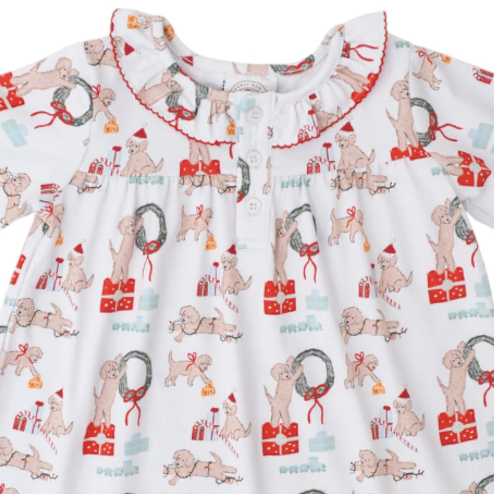 That Store girls lounge dress in white with a festive puppy Christmas print, featuring a ruffled collar and buttons.
