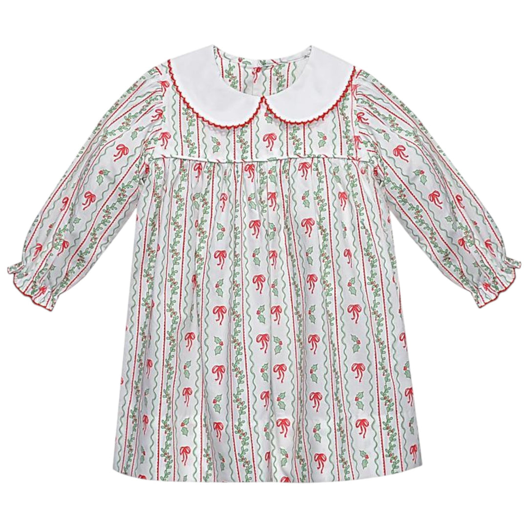 That Store girls Reagan dress in white cotton with red bows and green berries print and a white peter pan collar