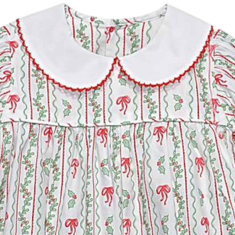 That Store girls Reagan dress in white cotton with red bows and green berries print and a white Peter Pan collar