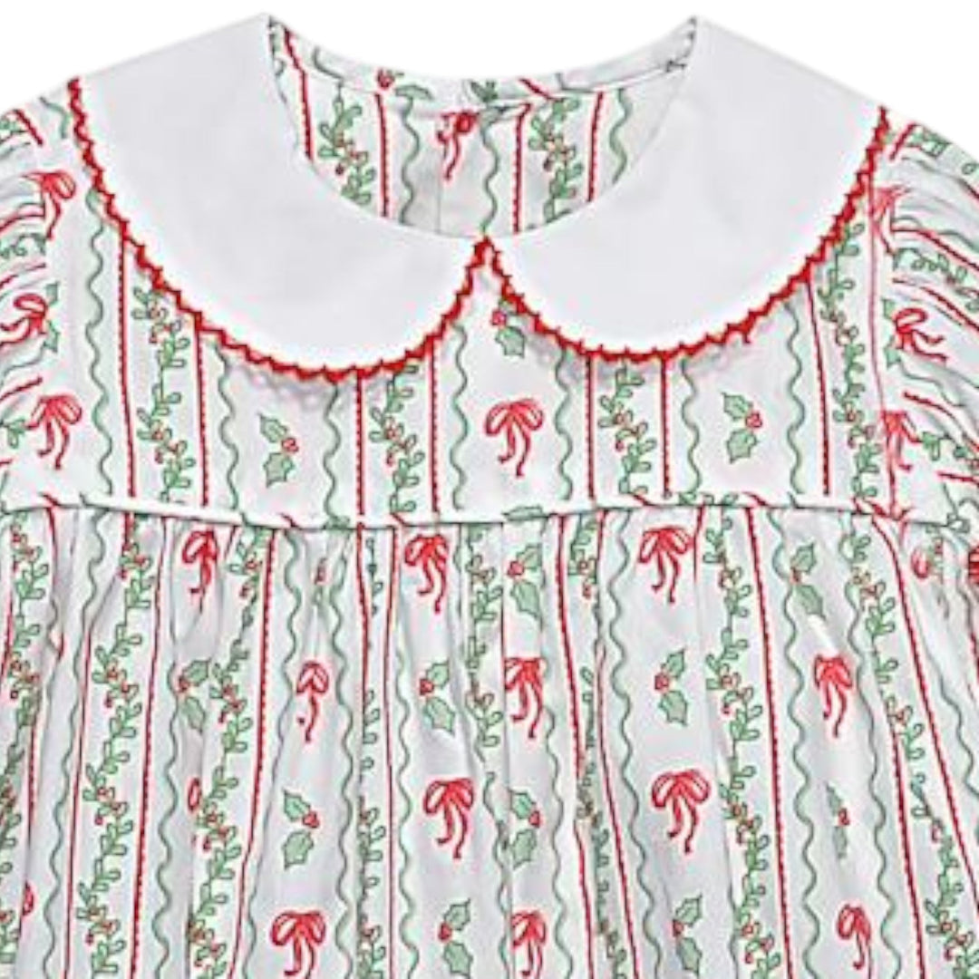 That Store girls Reagan dress in white cotton with red bows and green berries print and a white Peter Pan collar