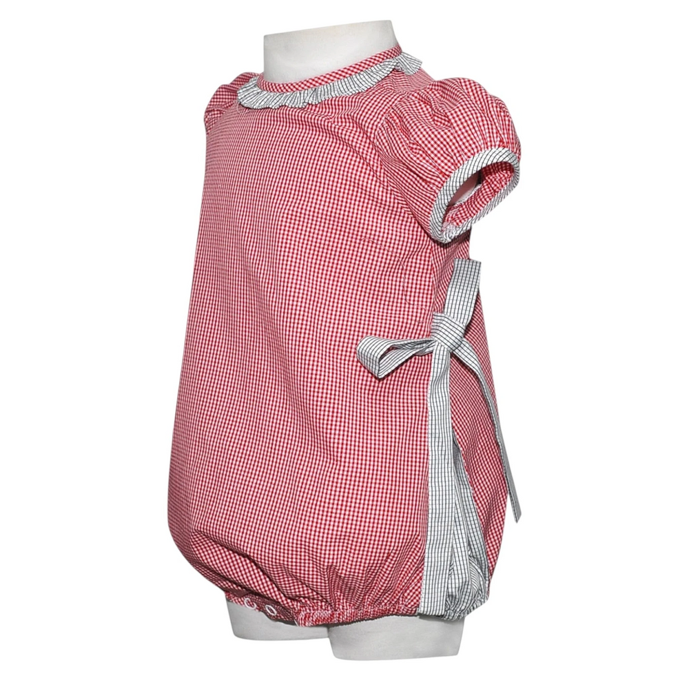 That Store girls bubble romper in red and black gingham with a side tie detail and ruffled collar.