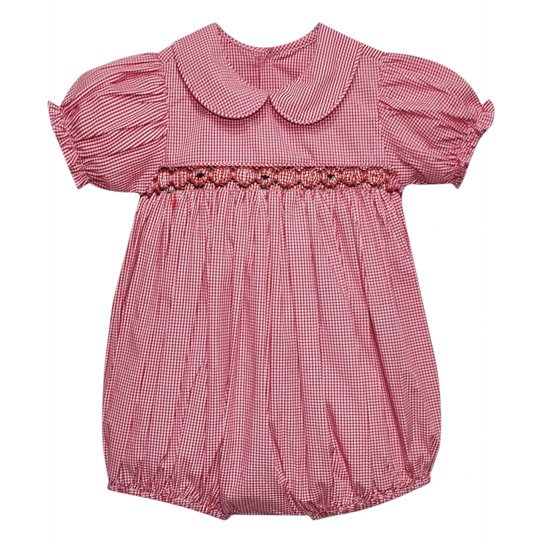 That Store girls red and black gingham bubble with smocked detailing, puff sleeves, and a peter pan collar.