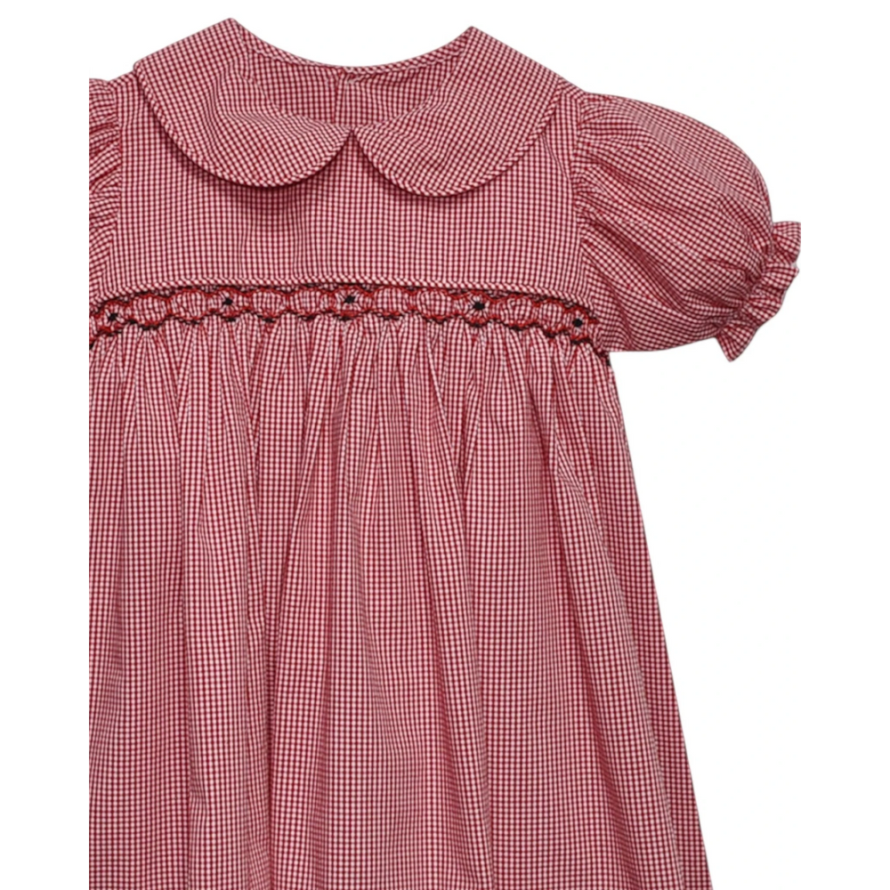 That Store red and black gingham smocked dress with a Peter Pan collar and puff sleeves for little girls.