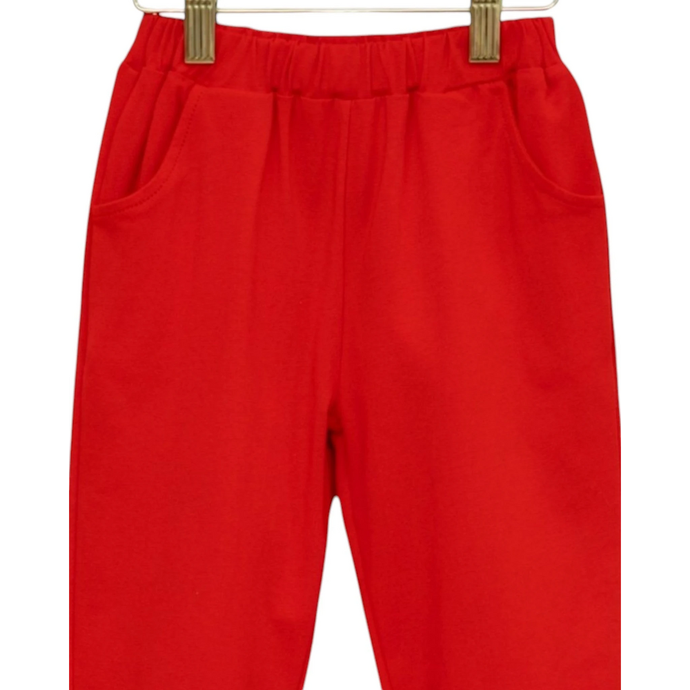 That Store red joggers for boys with an elastic waistband and side pockets, made from soft breathable fabric.