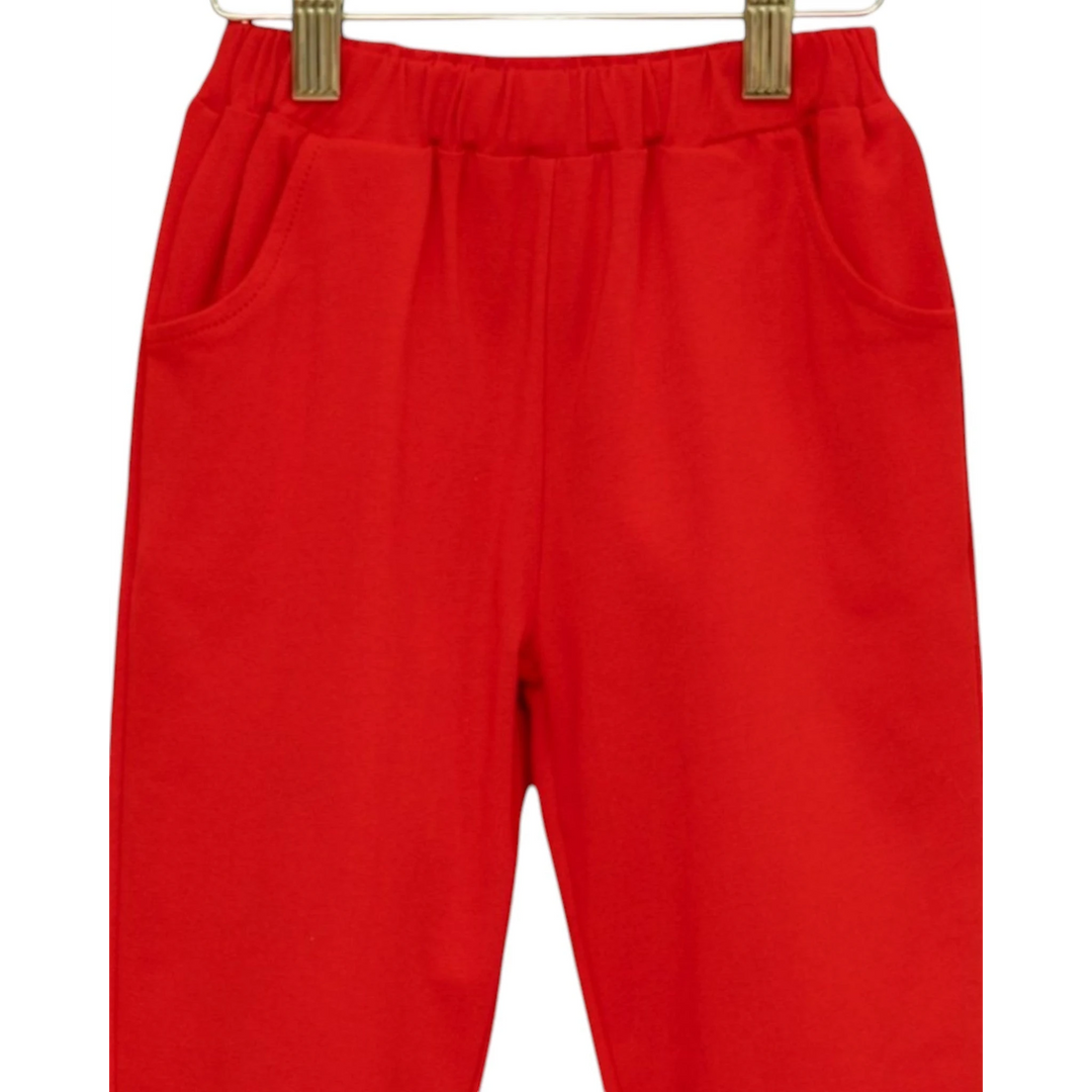 That Store red joggers for boys with an elastic waistband and side pockets, made from soft breathable fabric.