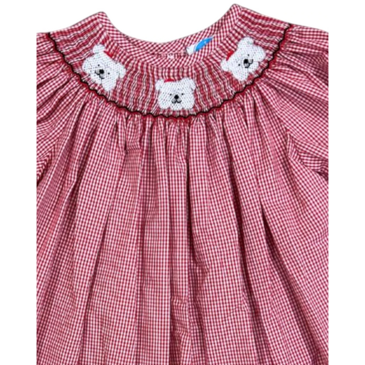 That Store red gingham bishop dress featuring hand-smocked white bulldog details with red accents on the neckline.