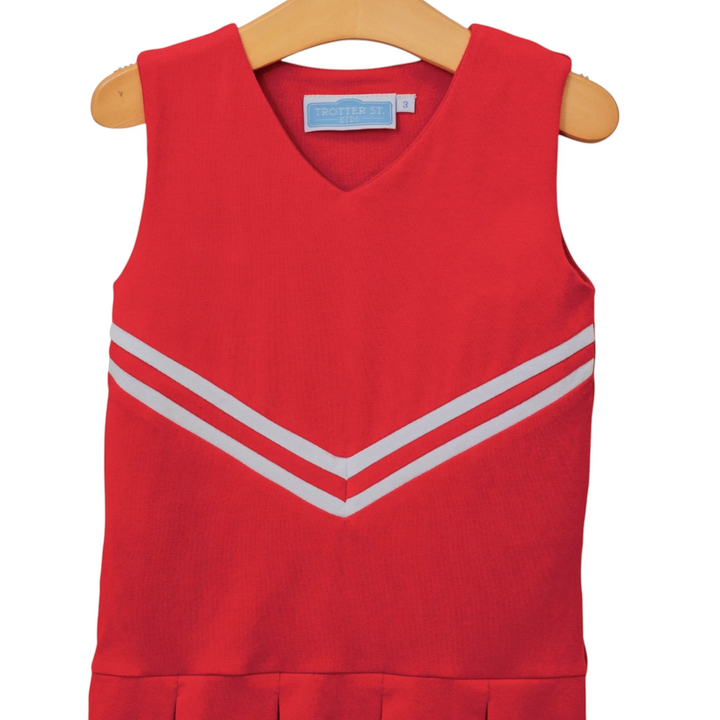 That Store red cheer uniform dress with white chevron stripes on a wooden hanger