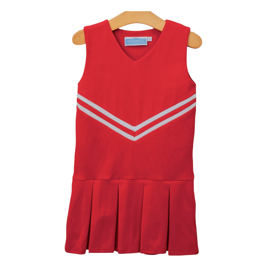 That Store red cheerleading uniform dress with white chevron stripes and a pleated skirt on a wooden hanger