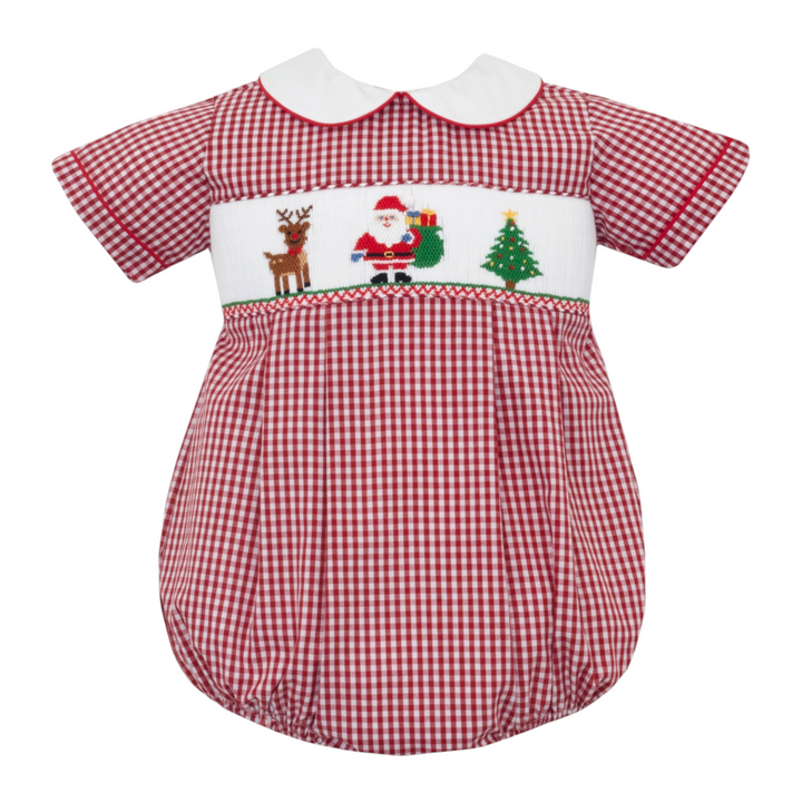 That Store boys bubble in red gingham featuring a white Peter Pan collar and smocked Santa, reindeer, and tree.