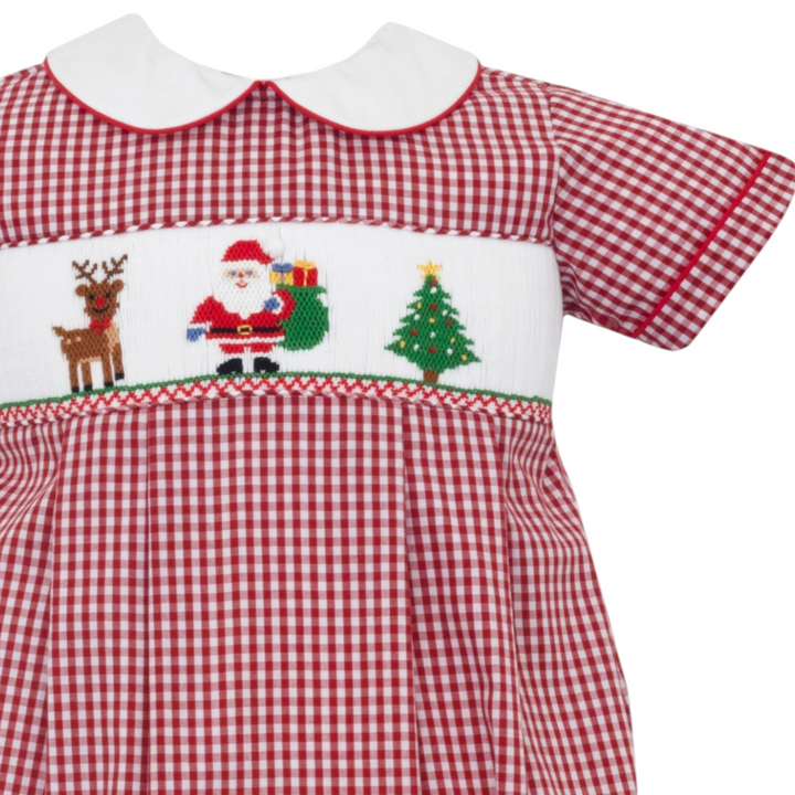 That Store boys bubble in red gingham with a white collar and smocked Santa, reindeer, and Christmas tree design.
