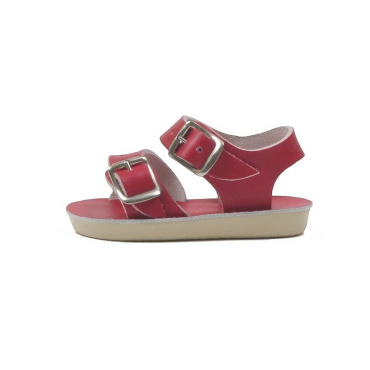 That Store Red Sea Wee Sandals in red leather with two adjustable brass buckle straps and a flexible urethane outsole.