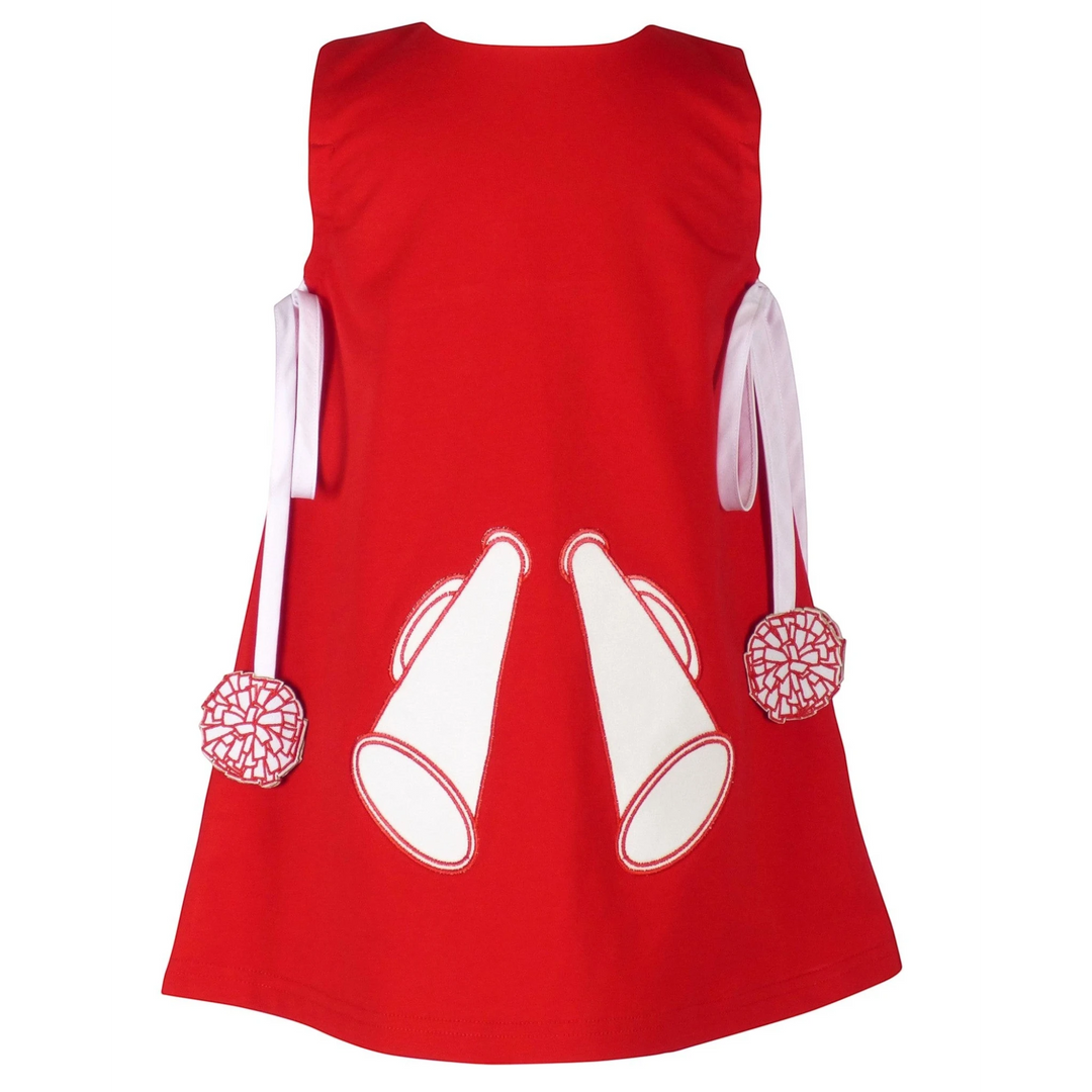 That Store red cotton jumper dress for girls with white megaphone appliques and pom-pom trimmed side ties