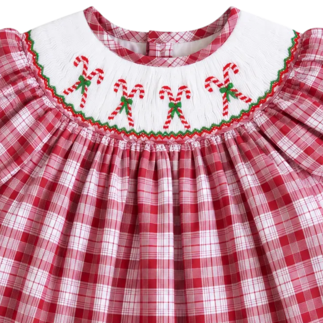 That Store girls red plaid bubble featuring white smocking with embroidered candy cane details for Christmas.