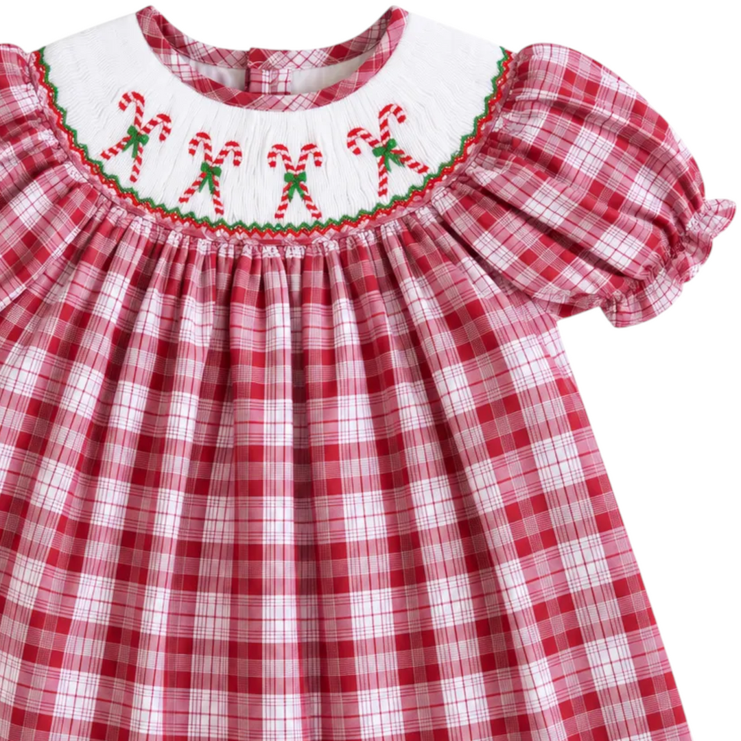 That Store girls red plaid cotton dress with white collar featuring festive candy cane smocking for Christmas.