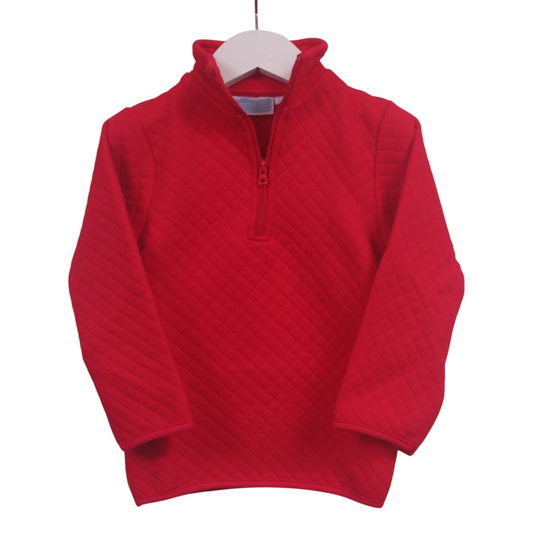 That Store red quilted 1/4 zip pullover for kids with a high collar, perfect for layering in cool weather.