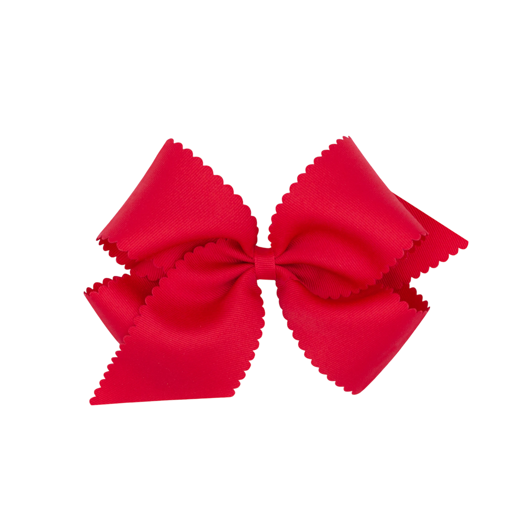 That Store red grosgrain hair bow for girls featuring a decorative scalloped edge and secure WeeStay clip