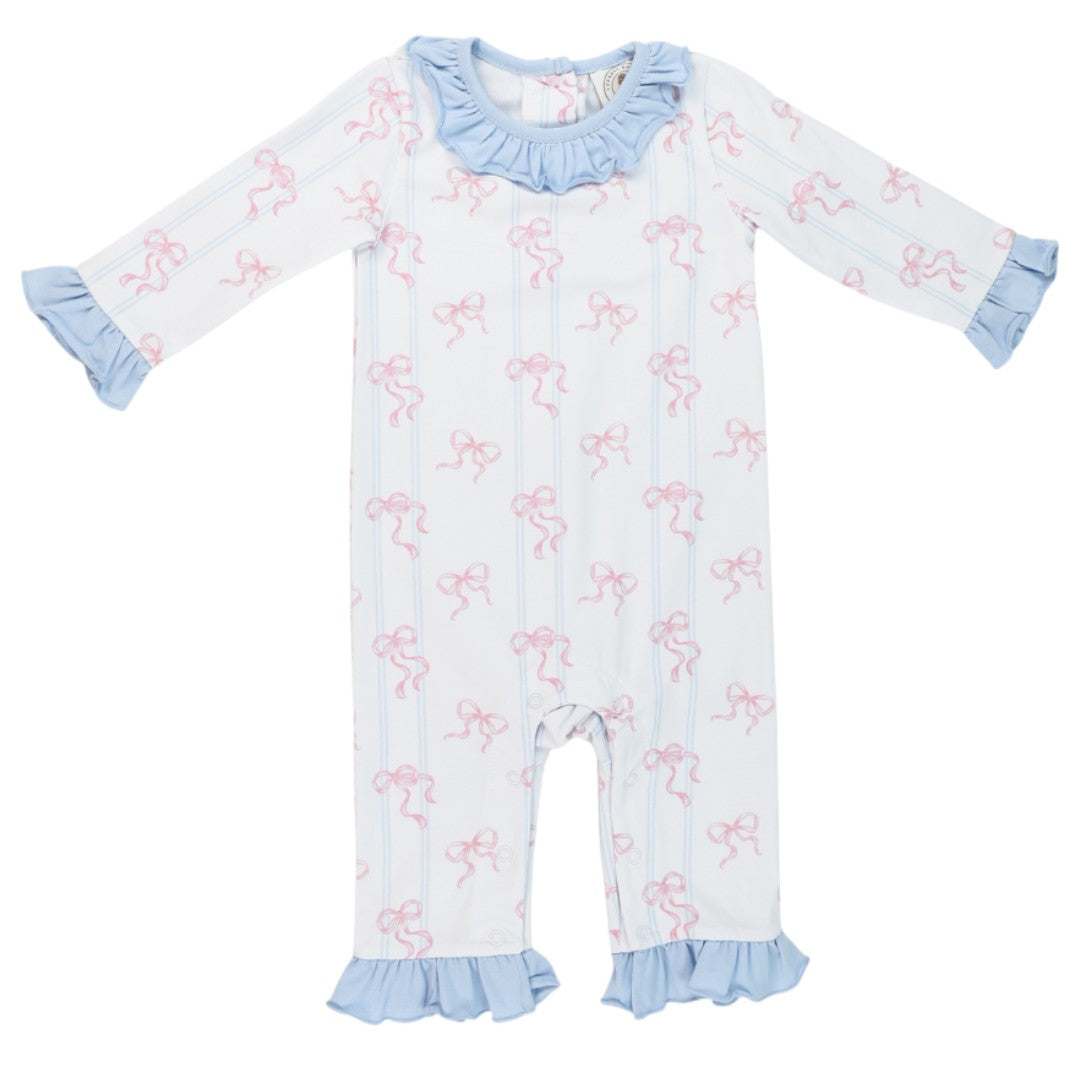 That Store Riley romper for girls featuring a white fabric with pink bows, blue ruffles, and long sleeves.