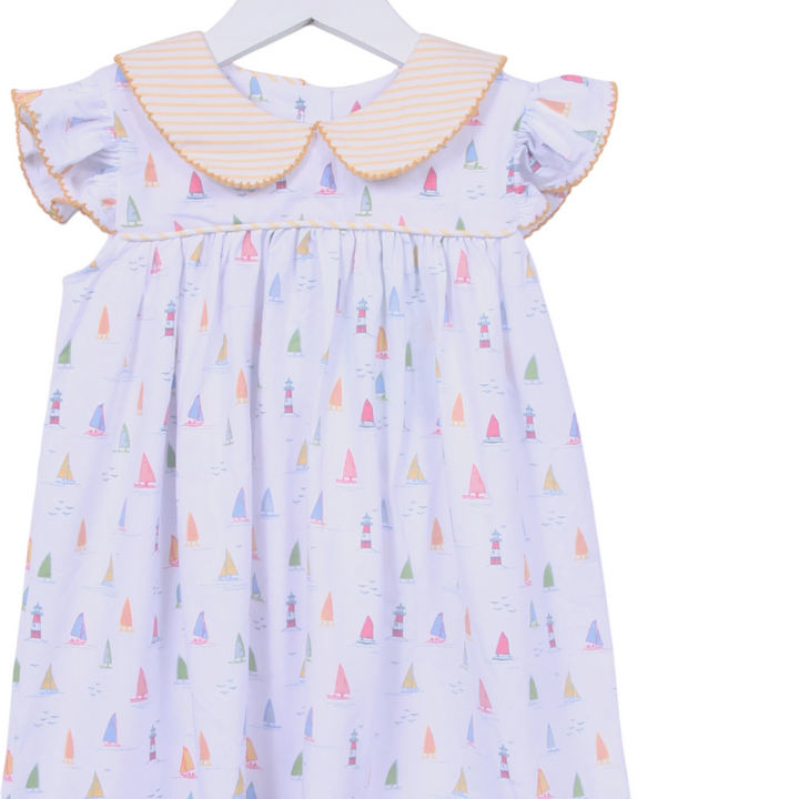 That Store white cotton dress with sailboat print, yellow striped Peter Pan collar, and angel wing sleeves.