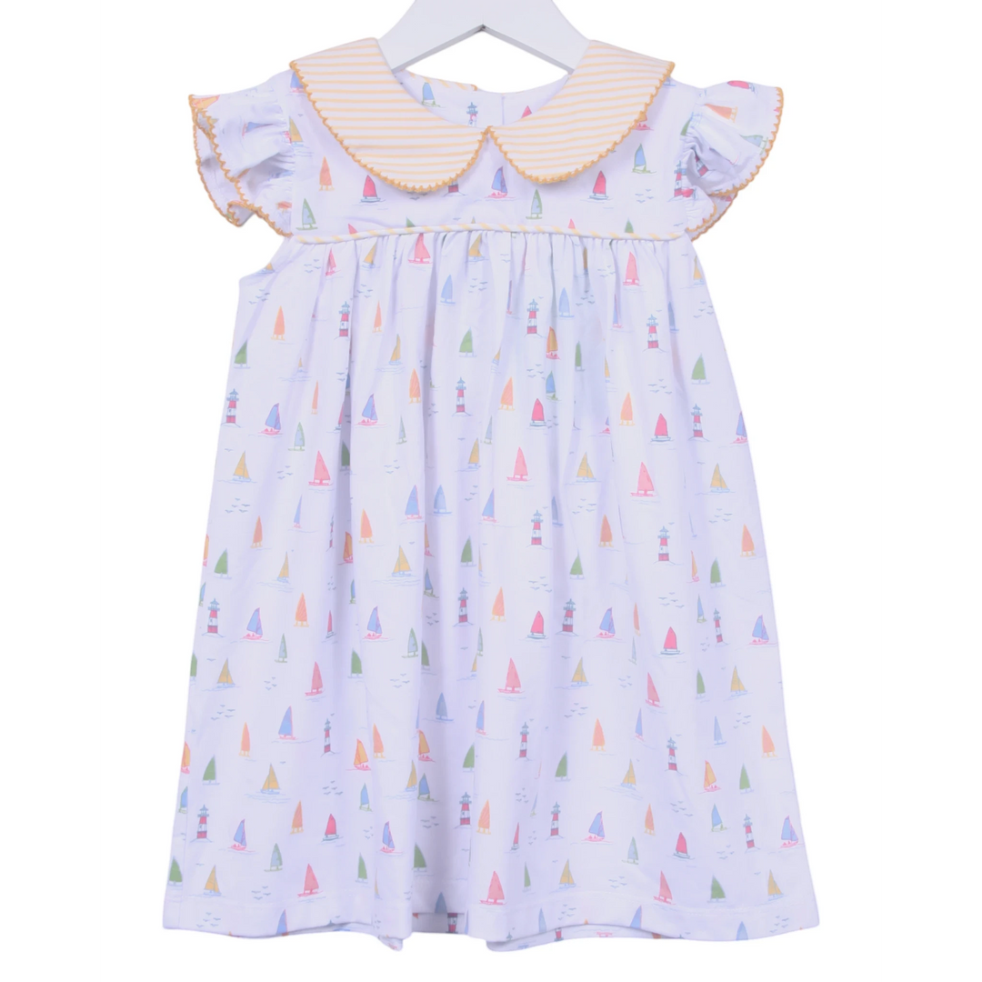 That Store white cotton dress with sailboat print, yellow striped peter pan collar, and angel wing sleeves.