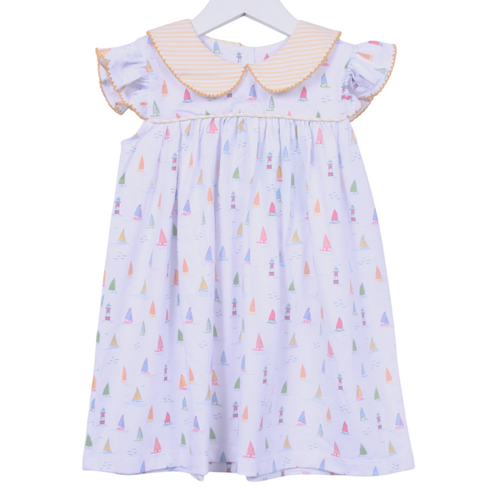 That Store white cotton dress with sailboat print, yellow striped peter pan collar, and angel wing sleeves.