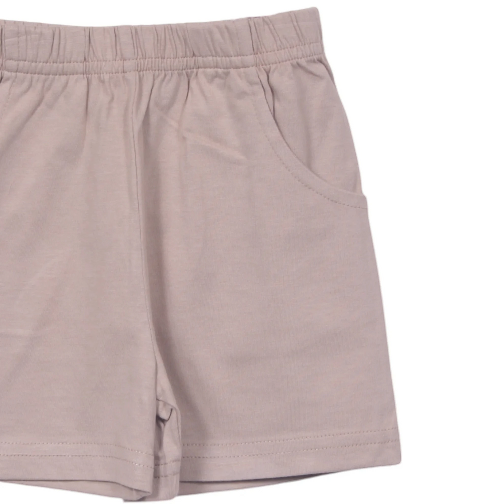 That Store sand-coloured boys jersey shorts featuring an elastic waistband and convenient front pockets in 100% cotton.