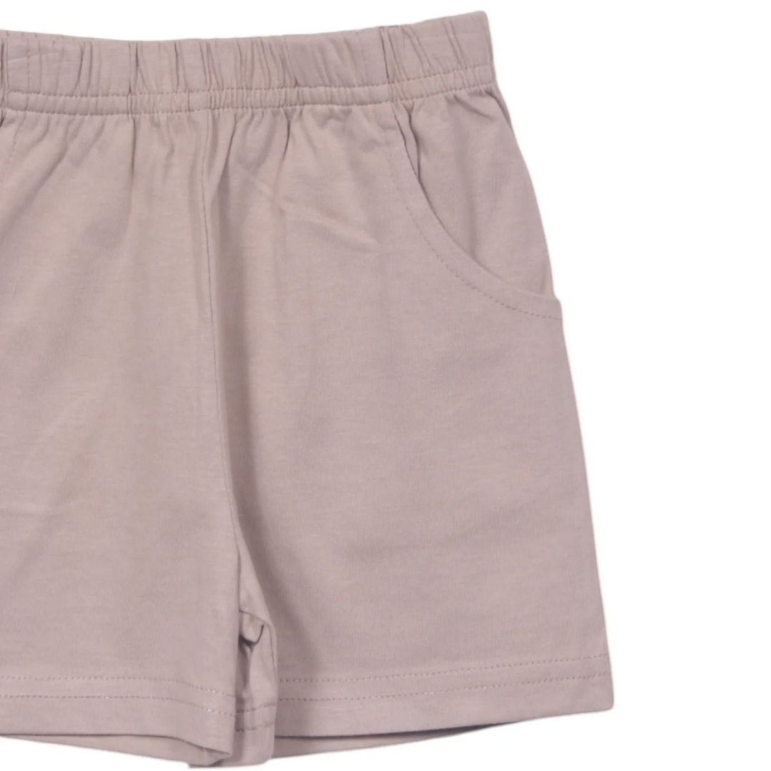 That Store sand-coloured boys jersey shorts featuring an elastic waistband and convenient front pockets in 100% cotton.