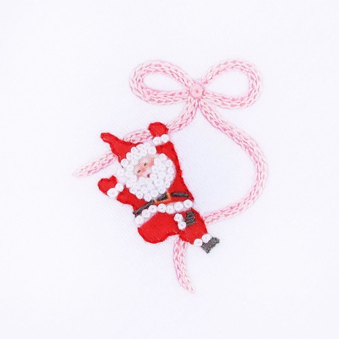 That Store hand-embroidered Santa and pink ribbon detail on white cotton fabric for a girls footie