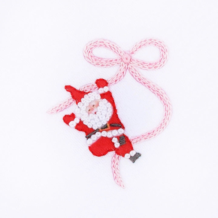 That Store hand-embroidered Santa and pink ribbon detail on white cotton fabric for a girls footie