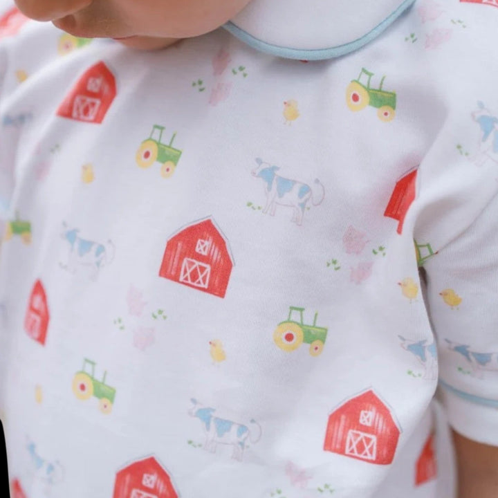 That Store Sibley boys pant set featuring a white knit top with a colorful barnyard animal and tractor print