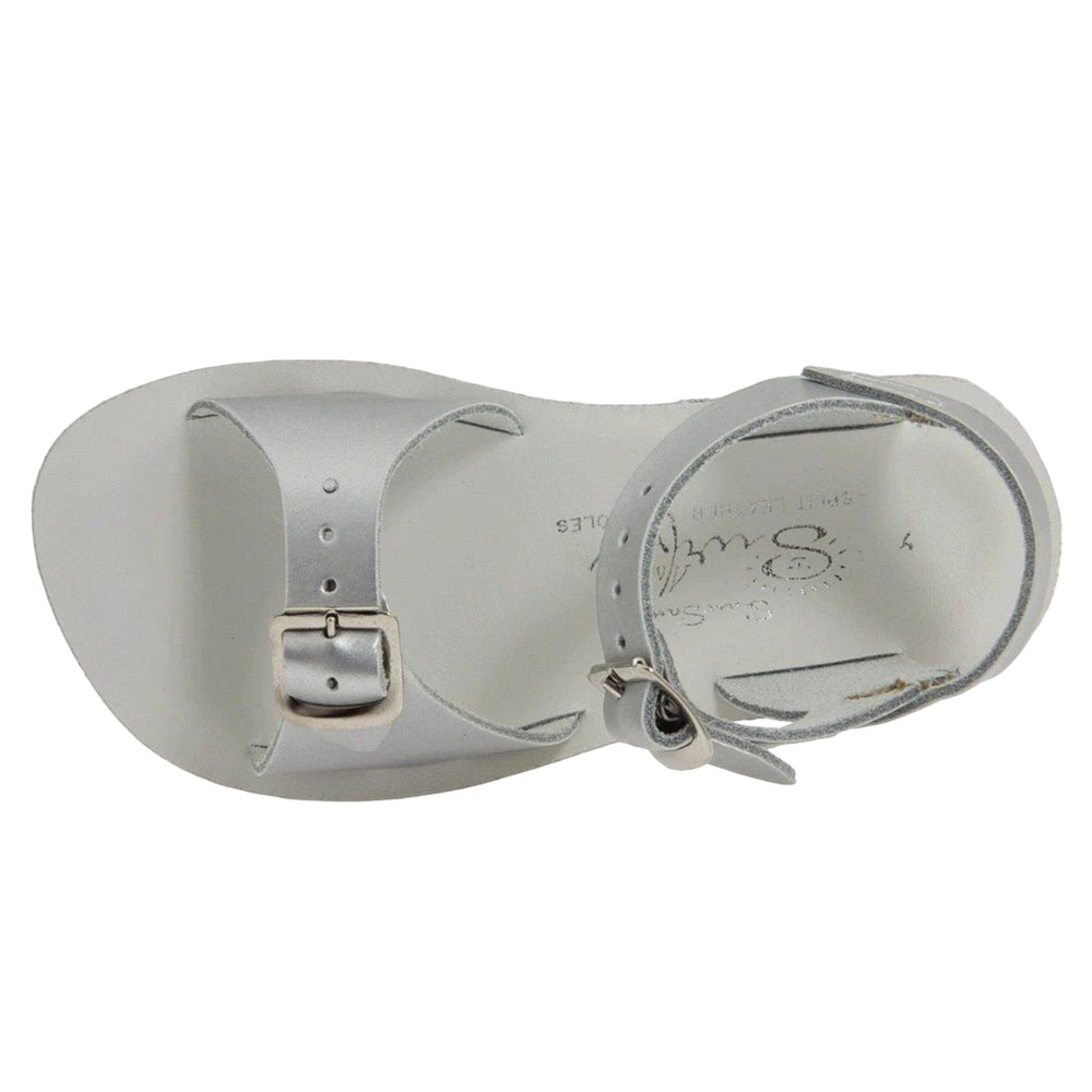 That Store Silver Surfer water-friendly leather sandals in metallic silver with adjustable brass buckle straps.