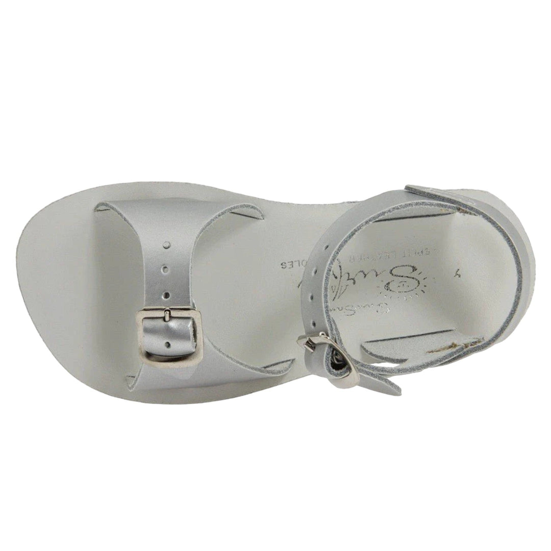 That Store Silver Surfer water-friendly leather sandals in metallic silver with adjustable brass buckle straps.