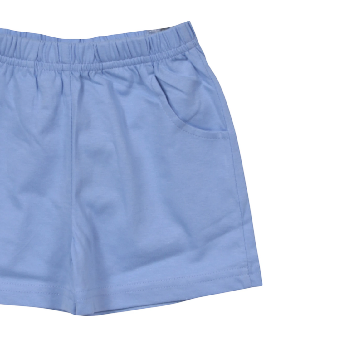 That Store sky blue cotton jersey boys shorts featuring an elastic waistband and convenient front pockets.