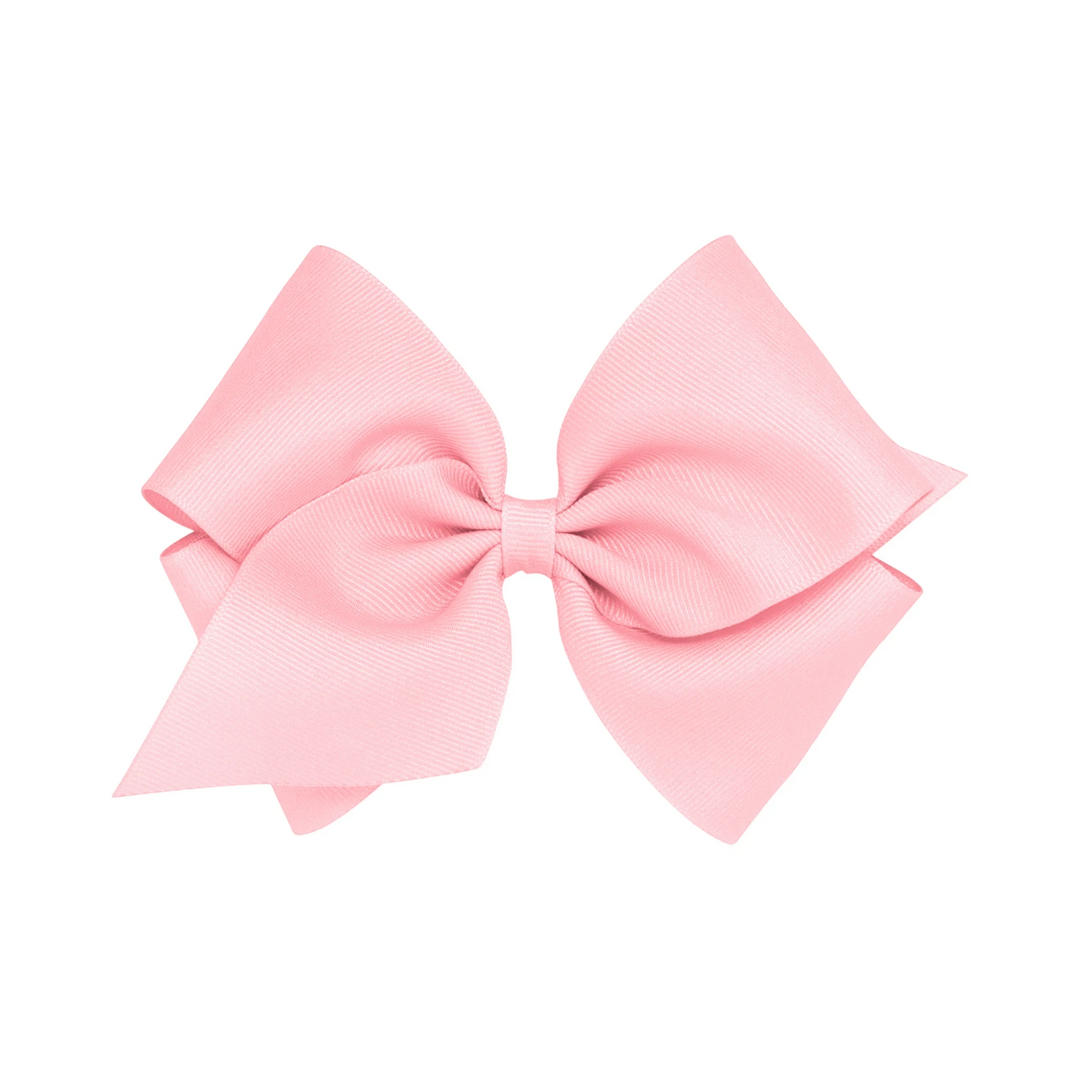 That Store small pink grosgrain hair bow with a patented no-slip alligator clip for toddlers and girls