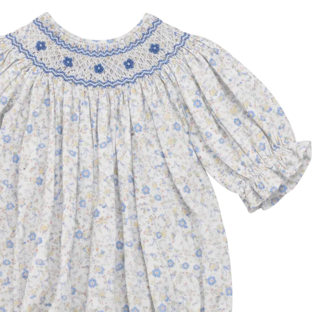 That Store girls smocked bubble in blue and yellow bow floral print with classic chest smocking and cotton fabric.