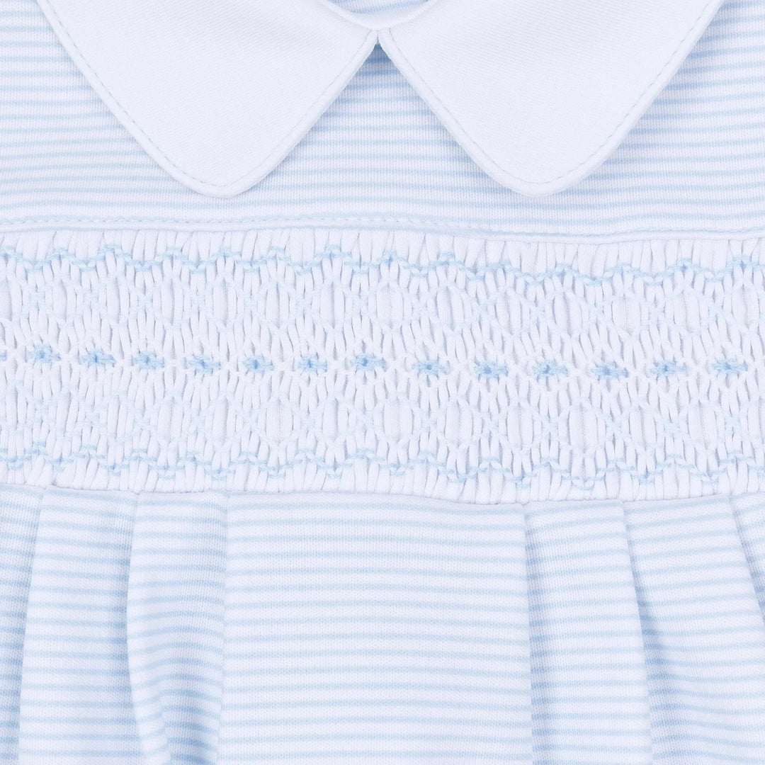 That Store light blue and white striped baby gown with hand-smocked chest detail and a classic Peter Pan collar.