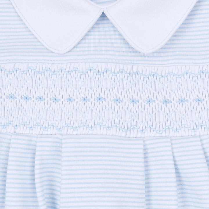 That Store light blue and white striped baby gown with hand-smocked chest detail and a classic Peter Pan collar.