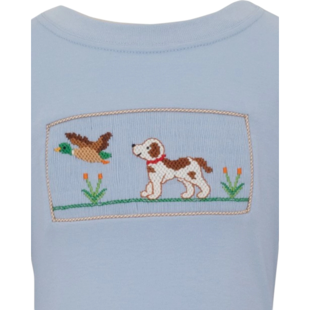 That Store blue cotton boys tee featuring a hand-smocked hunting dog and mallard duck design with gingham trim.